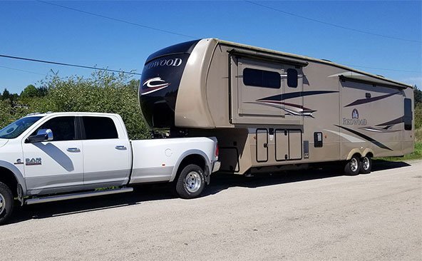 Transporting a RV on a fifth wheel.