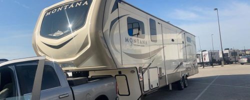 Transporting a RV on a fifth wheel.