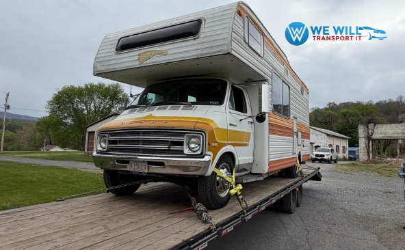 Transporting a 1977 Dodge Sportsman Honey Motorhome on a hotshot trailer.