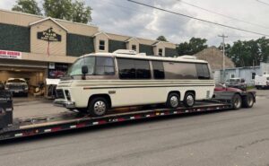 Transporting a 1977 GMC kingsley Motorhome on a RGN trailer.