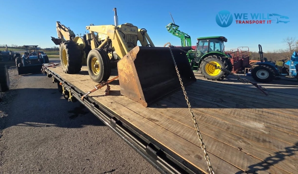 1980 Ford 4500 Backhoe secured on a 40ft Hotshot trailer for transport from Concord, New Hampshire to Orlando, Florida.