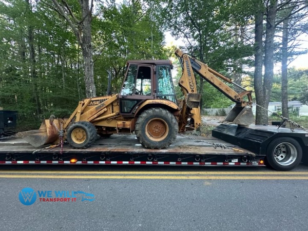 1990 Case 580K Backhoe secured on a RGN trailer for transport from Gulfport, Mississippi to Denver, Colorado.