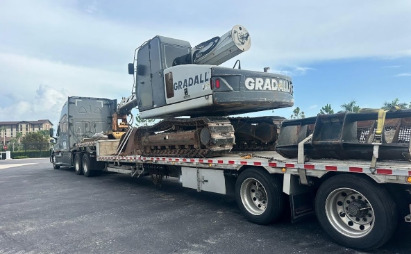 2009 Gradall XL 3200 secured on trailer for transport.