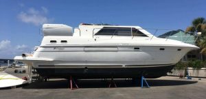 Boat Transport New York, White yacht park waiting to be transported