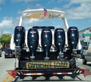 5 powerful engine in the back of a boat, beign transported on Seal boat trailer