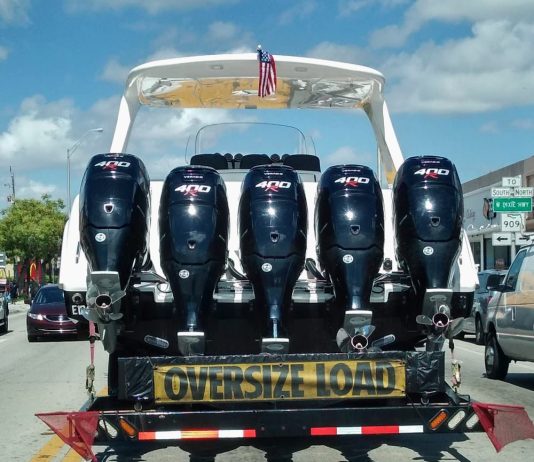 Tips for Moving Your Boat 5 powerful engine in the back of a boat, beign transported on Seal boat trailer