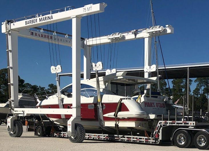 White and red yacht ready to be transported, Boat Transport Wisconsin