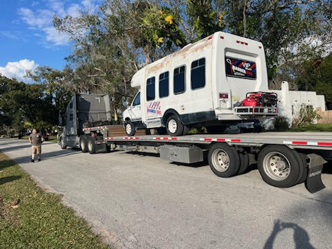 Moving a Bus with a Step deck Trailer