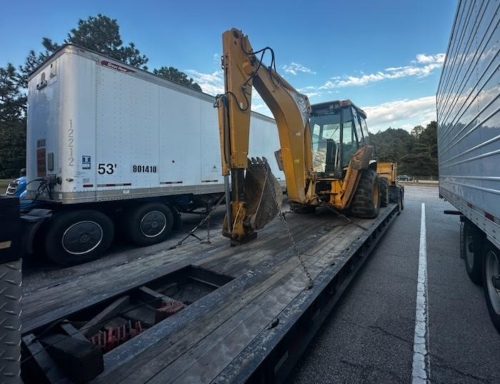 Caterpillar 430D Backhoe transport.