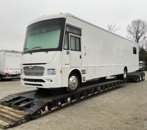 Class A motorhome on a lowboy trailer Class A motorhome on a lowboy trailer transportation.