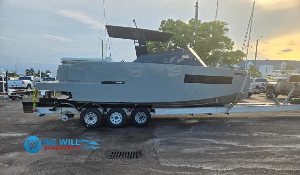 De Antonio Yachts D28 on a aluminum triple-axle bunk trailer transported from Long Island, New York to Miami, Florida.