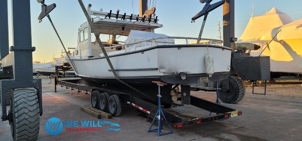 Downeast lobster work boat being prepared for transport at a boatyard to go from Houston, Texas to Southwest Harbor, Maine.