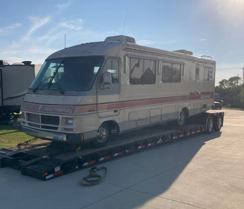 Hauling a 1988 Fleetwood Southwind motorhome on a RGN trailer.