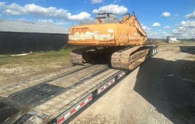 Hauling a 2004 Case CX210 excavator on a lowboy trailer.