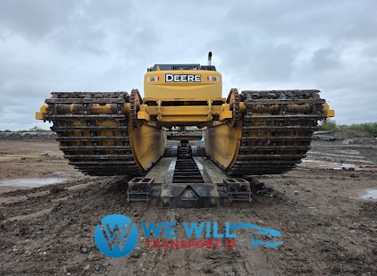 Hauling a 2025 John Deere 210G Amphibious Excavator on a RGN trailer.