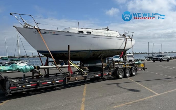 Alberg 35 Sloop Sailboat overland hauling on a triple-axle flatbed sailboat transport trailer from Galveston, Texas to Annapolis, Maryland.