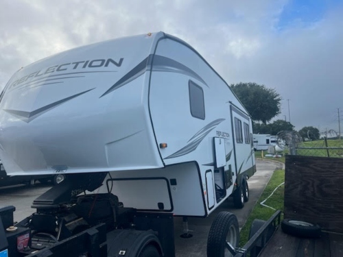 Hauling a Grand Design fifth wheel RV being bulled by a truck.
