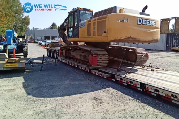 John Deere 350g Excavator secured on a RGN trailer transported from Bangor, Maine to Bozeman, Montana.