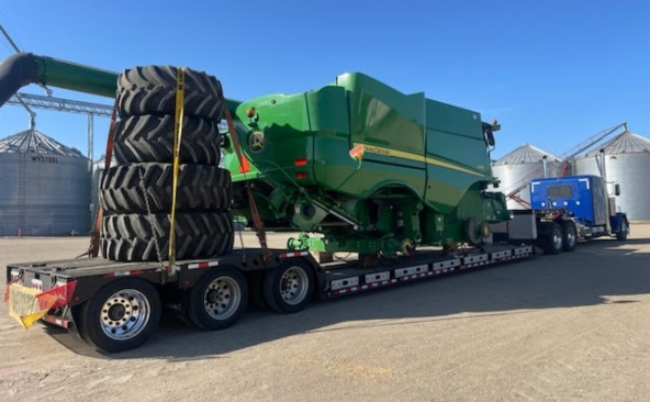 John Deere combine harvester transportation from Des Moines, Iowa to Bloomington, Illinois.