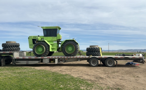Hauling a Steiger tractor on a step deck trailer.