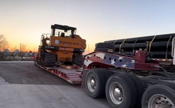 Hauling a Superior Pipelayer on a RGN trailer.