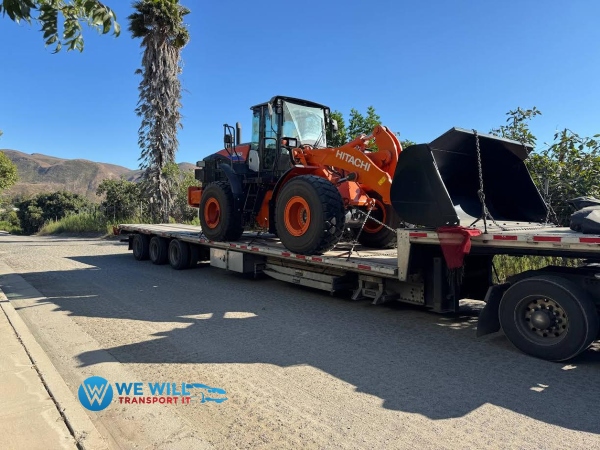 Hauling a Hitachi Wheel Loader on a step deck trailer from Salina, Kansas to Santa Fe, New Mexico.