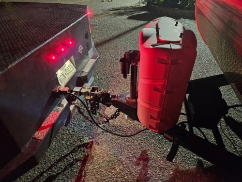 Transportation of a travel trailer using a hitch.