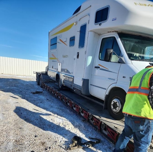 Shipping a Itasca Navion motorhome loaded on a detachable RGN lowboy trailer.