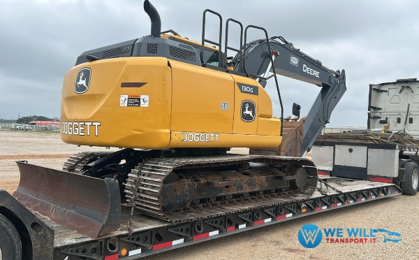 Hauling a John Deere 130G Excavator on a lowboy trailer from St. Cloud, Minnesota to Chicago, Illinois.