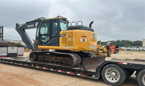 John Deere 130G excavator on flatbed ready for delivery.