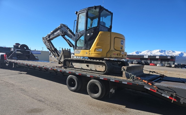 John Deere 60G compact excavator transport on a gooseneck hotshot trailer.