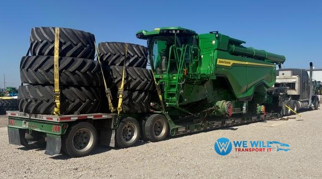 John Deere Combine Harvester on a low boy trailer for transport from Dubuque, Iowa to Sheridan, Wyoming.