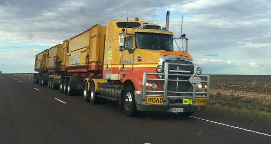 Heavy Equipment Transport from Mississippi to Florida Truck on Road
