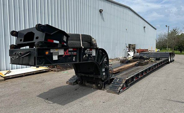 Lowboy trailer farm equipment transport