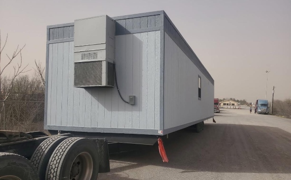 Hauling a mobile office on a mobile home trailer.