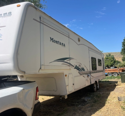 Moving a 2023 Keystone Montana RV being pulled by a truck using a hitch.