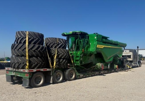 Moving a John Deere combine harvester on a RGN trailer.