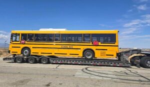 Shipping a School Bus on a RGN trailer.