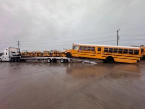 Shipping a School Bus on a step deck trailer.