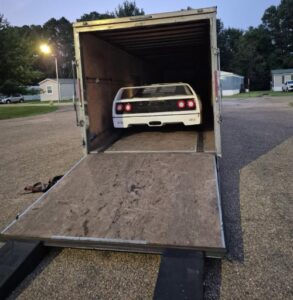 Shipping a 1986 Pontiac Fiero Kit car Shipping a 1986 Pontiac Fiero Kit car loaded by a loading ramp in a enclosed trailer.