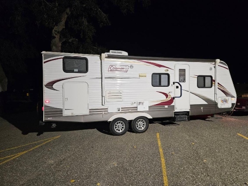 Shipping a Coleman travel trailer with a hitch being pulled by a pick up truck.