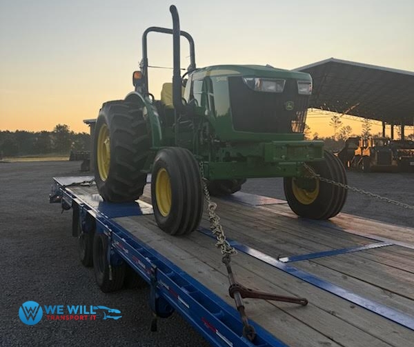 Shipping a John Deere 5065 E Tractor on a gooseneck trailer from Duluth, Minnesota to Kansas City, Missouri.
