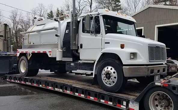Shipping-a-Tank-truck-with-a-boom Heavy Equipment Transport from Massachusetts to Texas