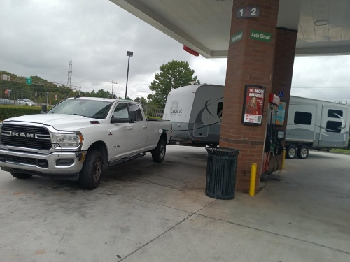Ram truck transporting a towable travel trailer.
