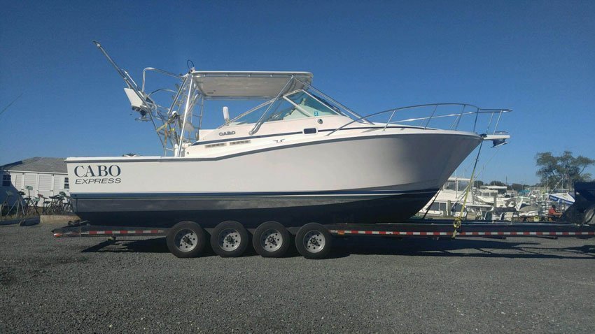 Should-You-Hire-Someone-to-Prepare-Your-Boat-for-Transport-3 White yacht ready to be transported