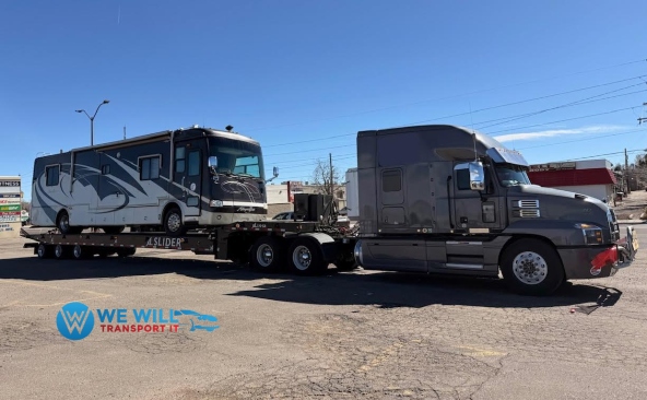 Transporting a Tiffin Allegro Bus Motorhome on a landoll trailer.
