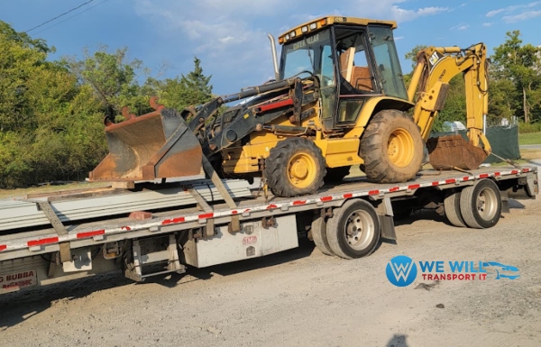 Transporting a Caterpillar 420D Backhoe Loader on a flatbed trailer from Billings, Montana to Atlanta, Georgia.