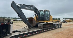 Transporting a John Deere 130G Excavator Transporting a John Deere 130G Excavator on a lowboy trailer that was picked up in Spring Town, Texas and delivered to Inverness, Florida.