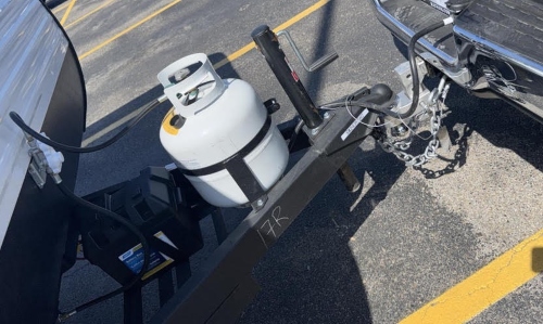 Transporting a travel trailer hitched to a truck.
