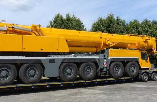 Heavy Equipment Transport from Wisconsin to Iowa Truck Mounted Crane Transport